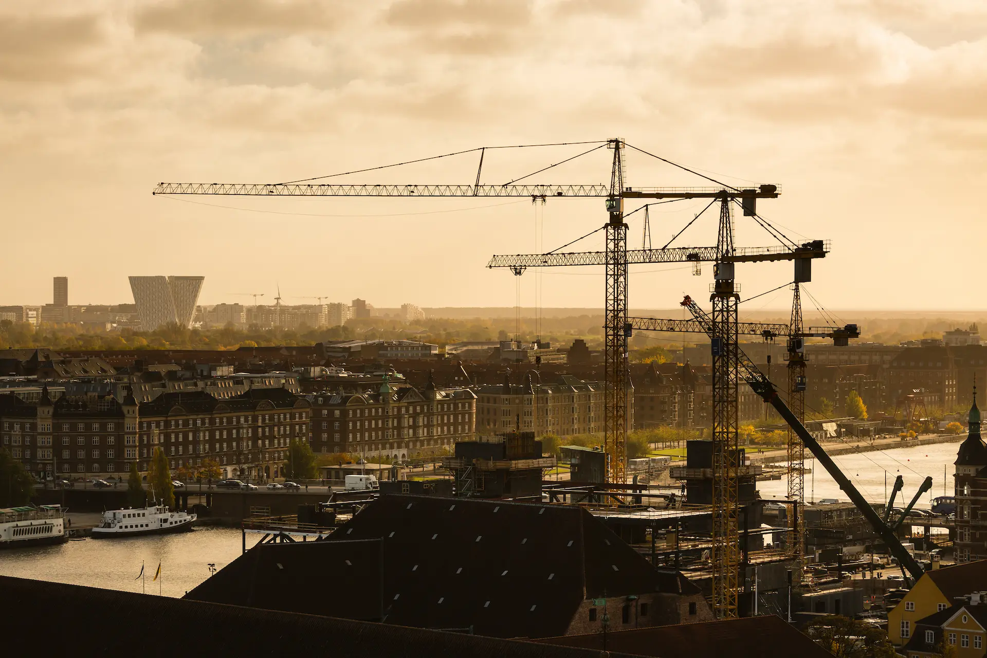 Urban Infrastructure Development with Construction Cranes