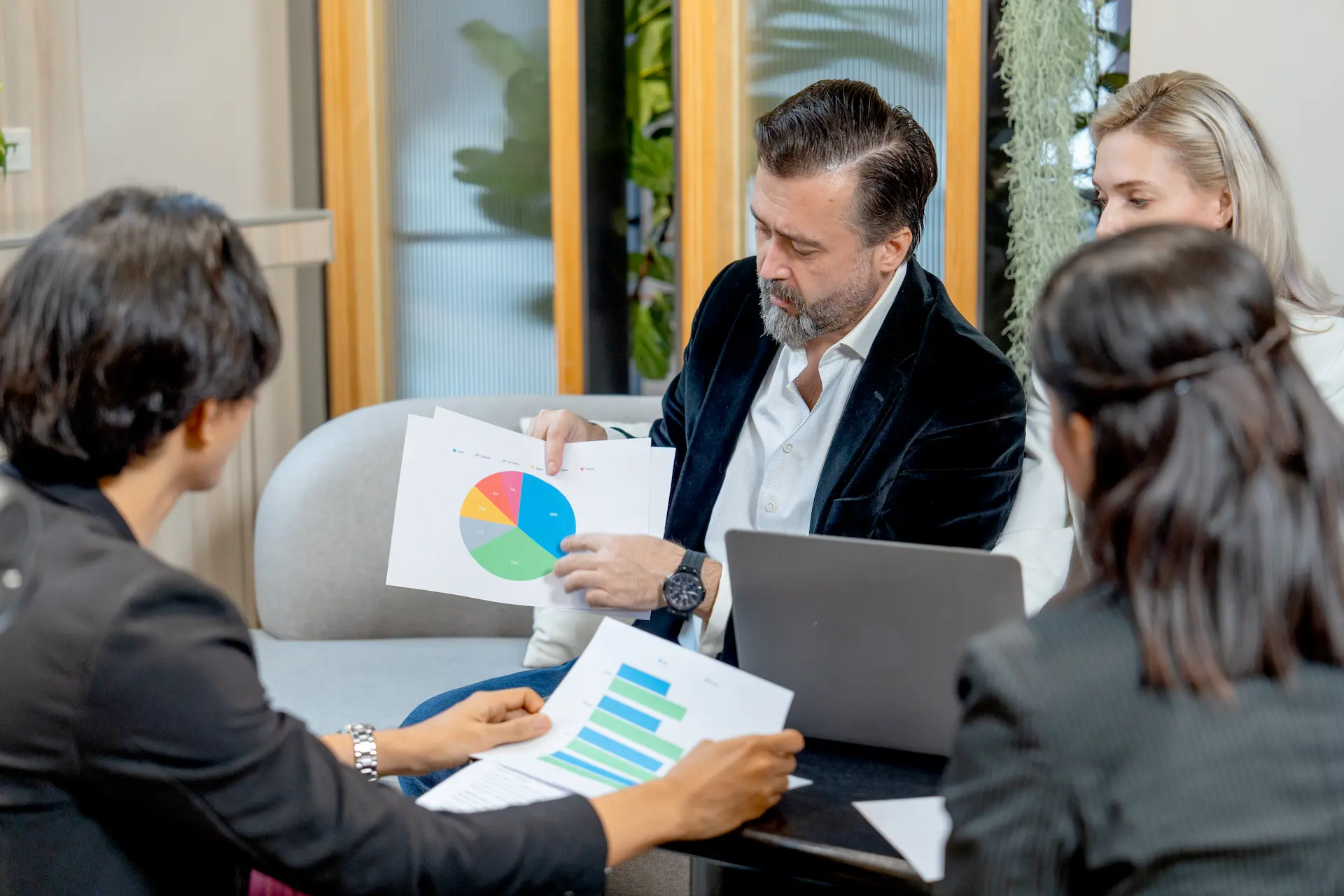 Investors discussing market analysis for Berlin real estate investment 2025