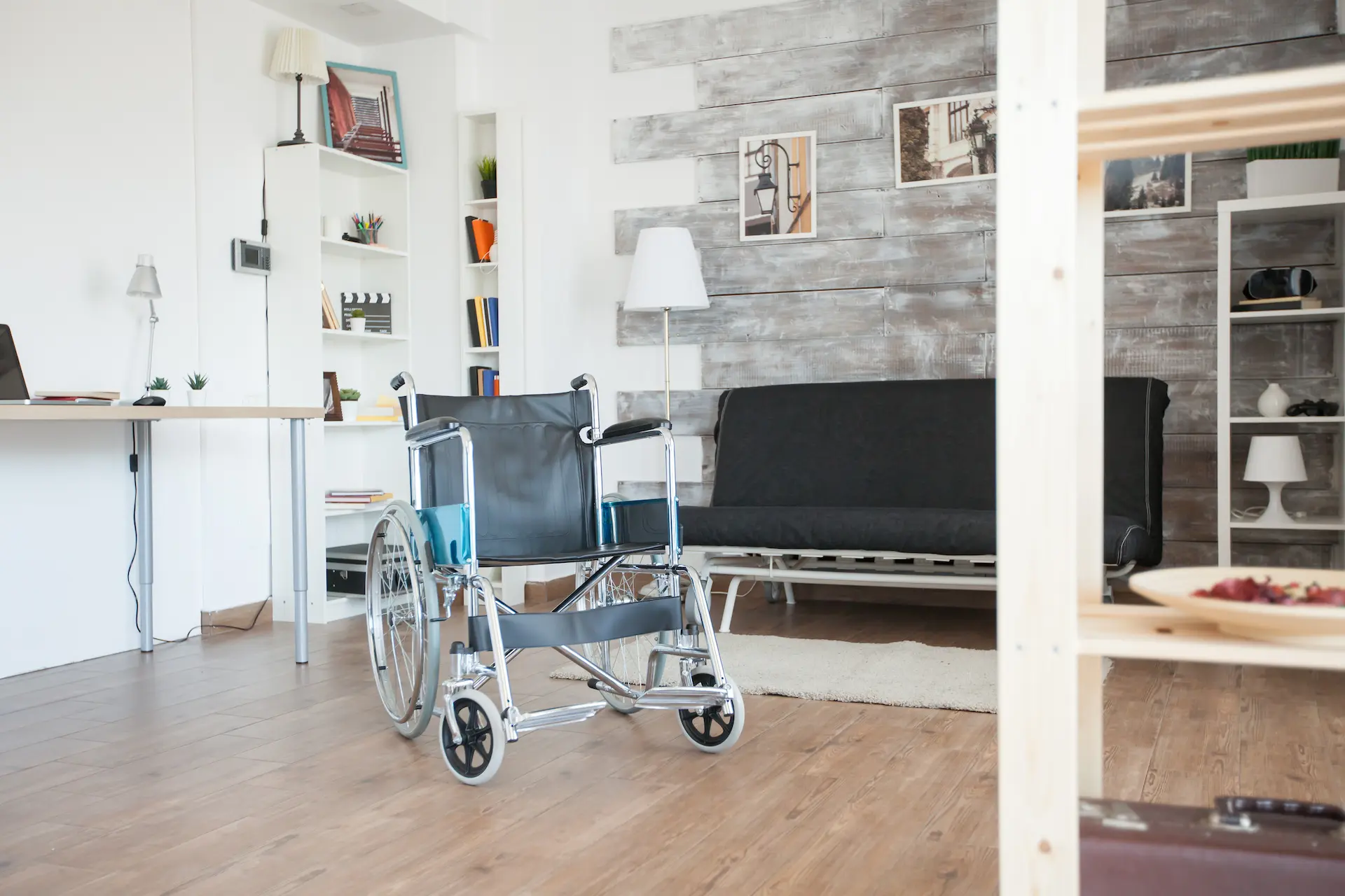 Bright, modern apartment with wooden floor and wheelchair – example of an accessible apartment in Berlin