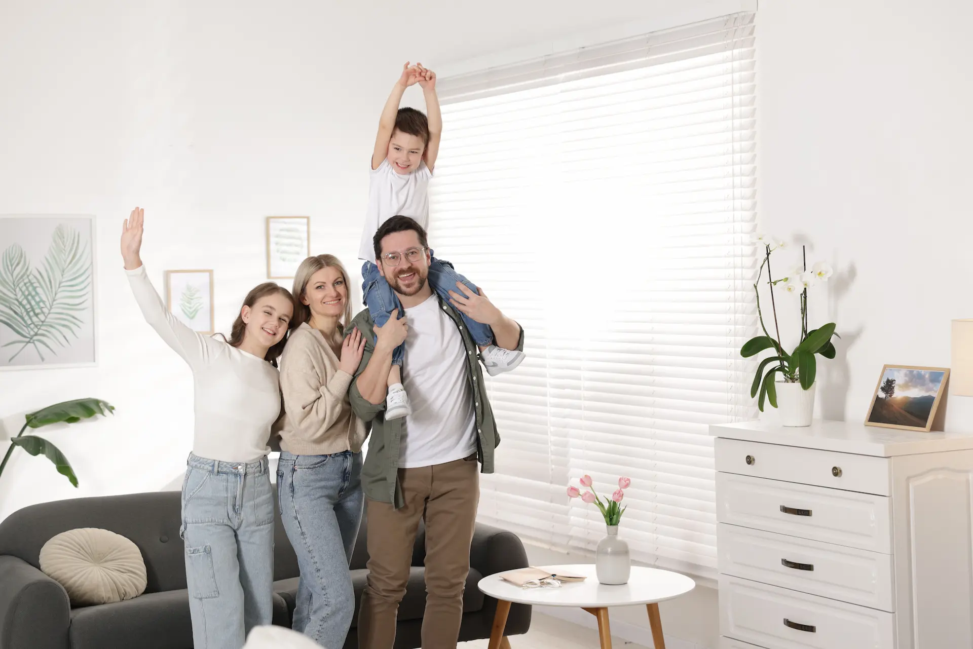 Happy family in the bright living room of a modern family apartment Berlin.