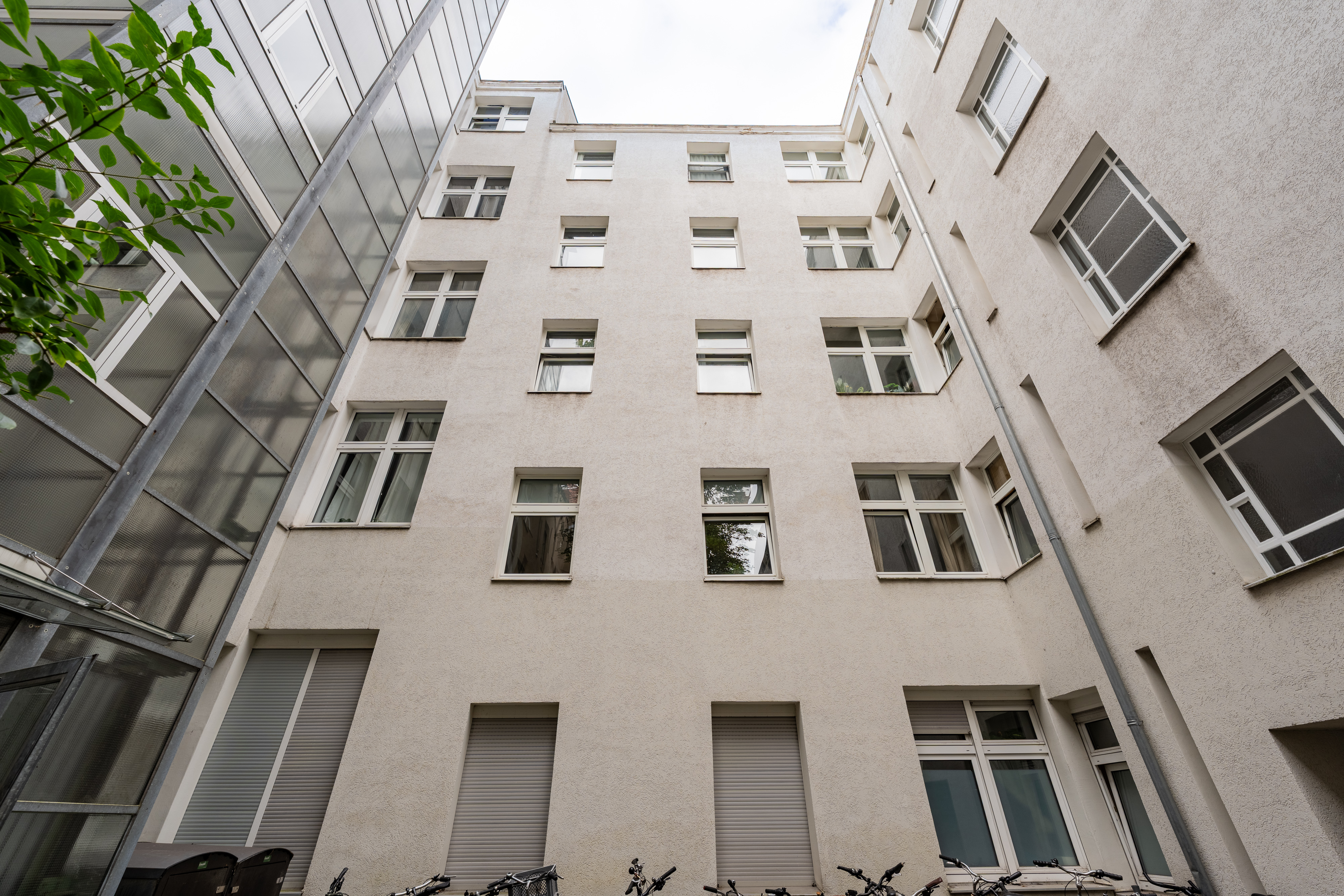 Apartment building courtyard with windows and bicycles
