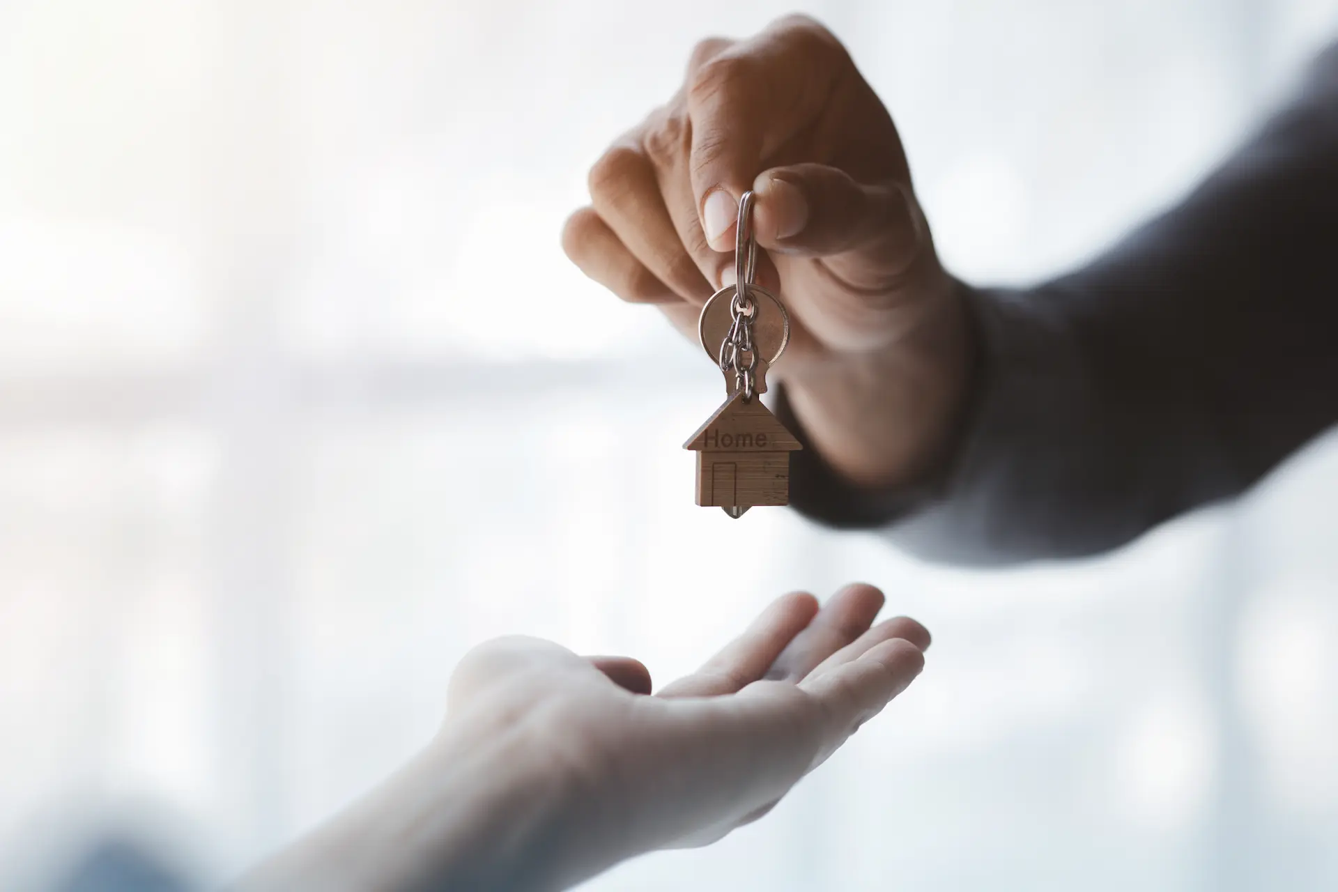 Handing over keys for a new home.