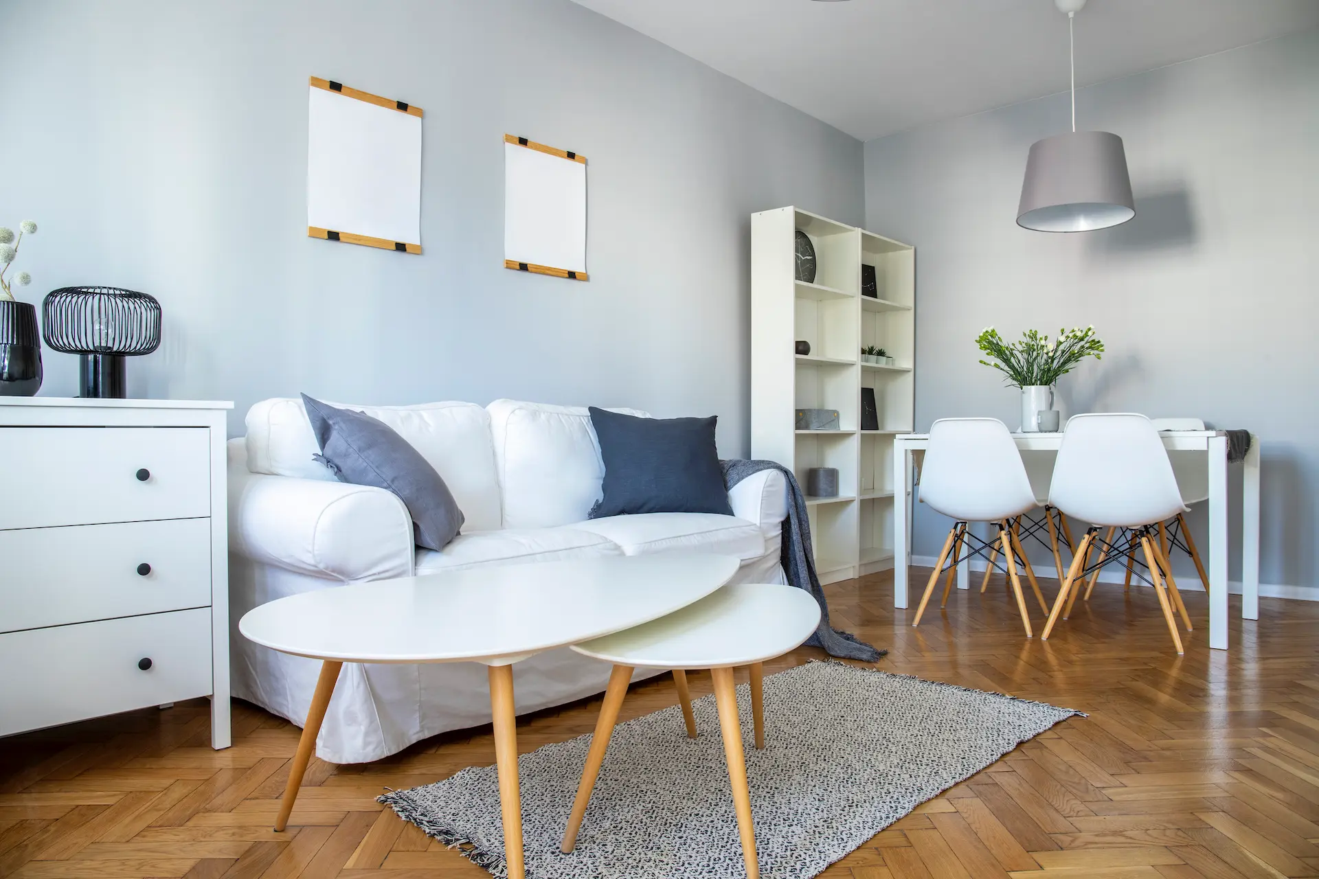Minimalist living room with white sofa and round tables