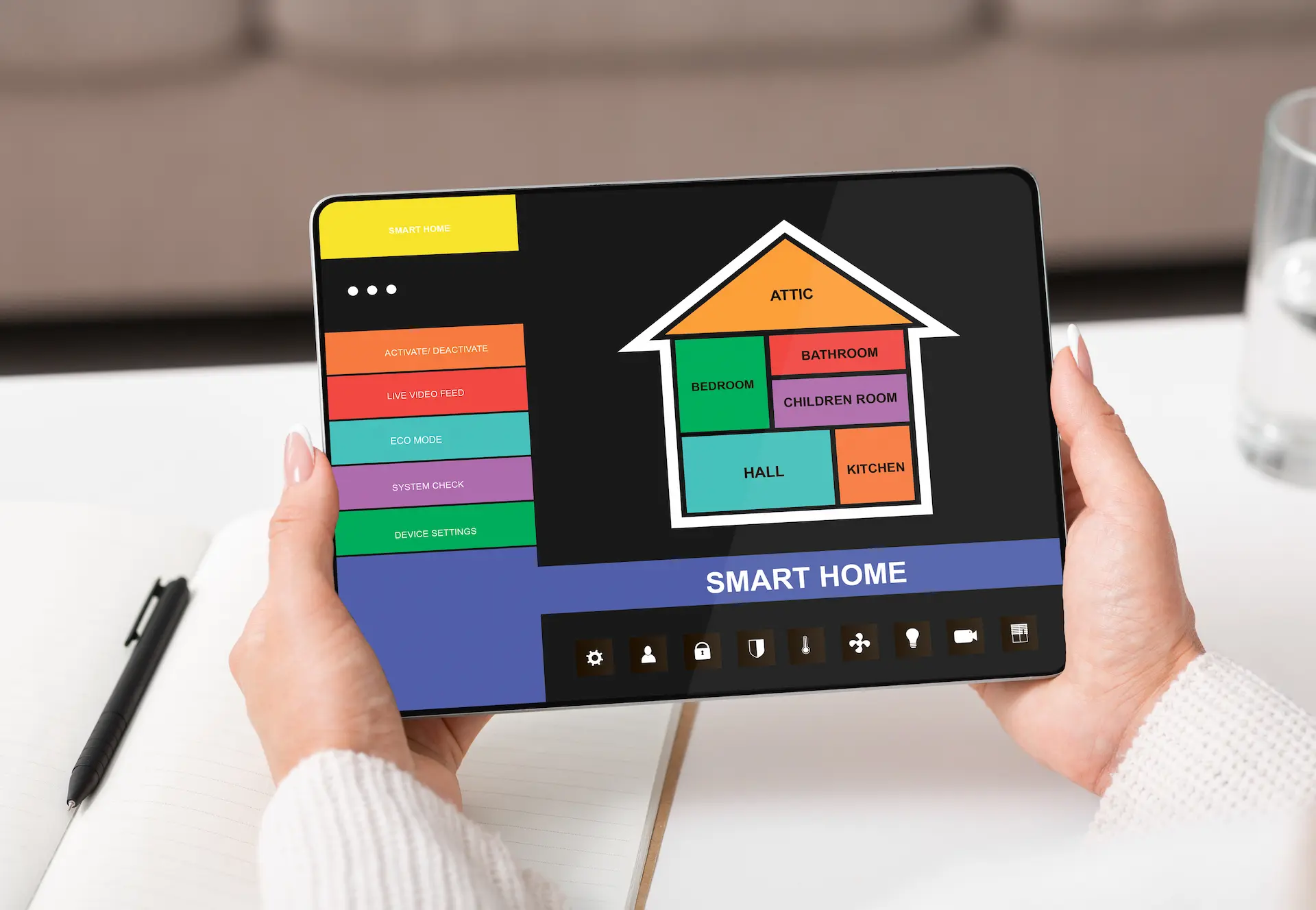 Tablet with smart home control and house overview in hands