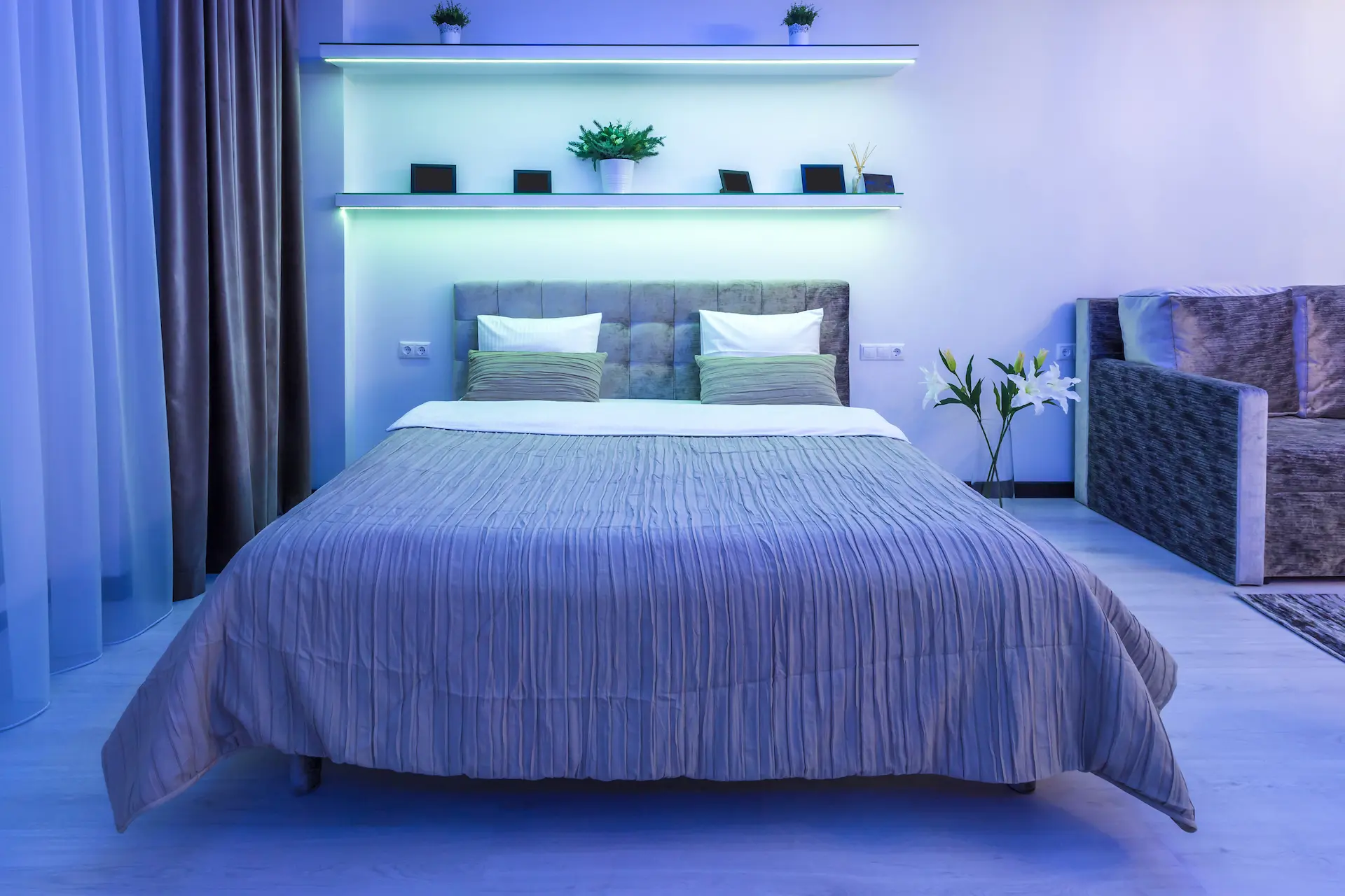 Modern bedroom with indirect lighting and double bed