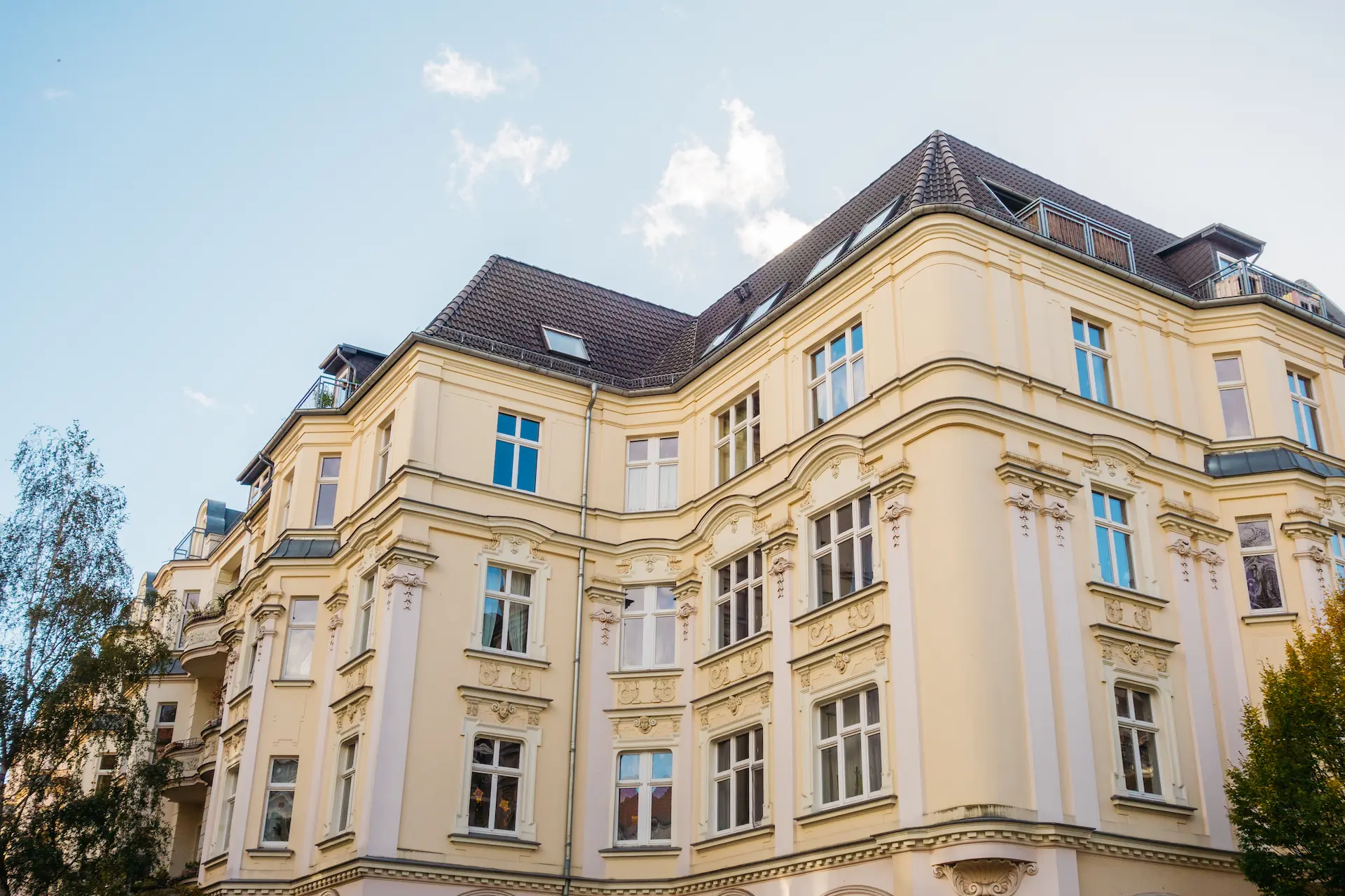 Historic residential building with ornate facade and dormer windows